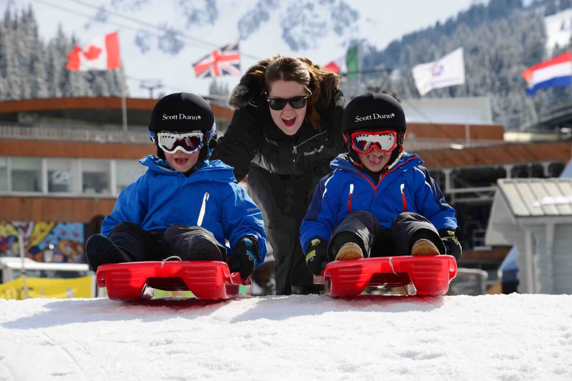 Scott Dunn staff nanny sledding with kids