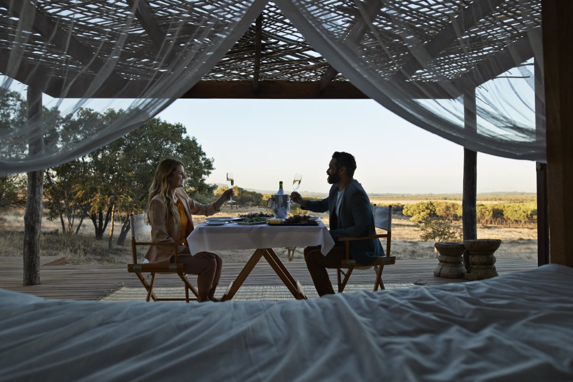 a couple at a luxury safari lodge