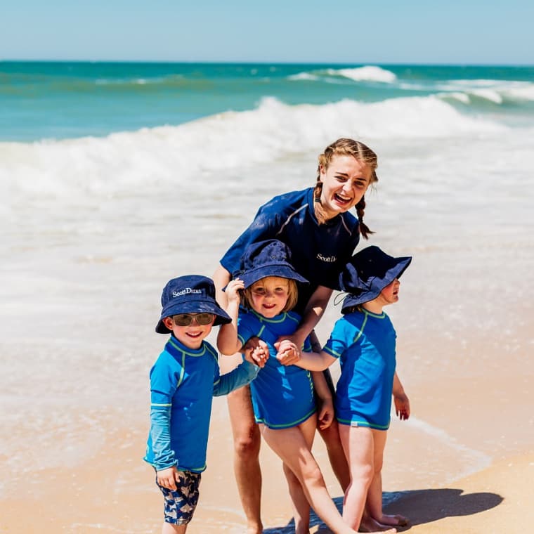 Scott Dunn staff with kids on the Pine Cliffs beach