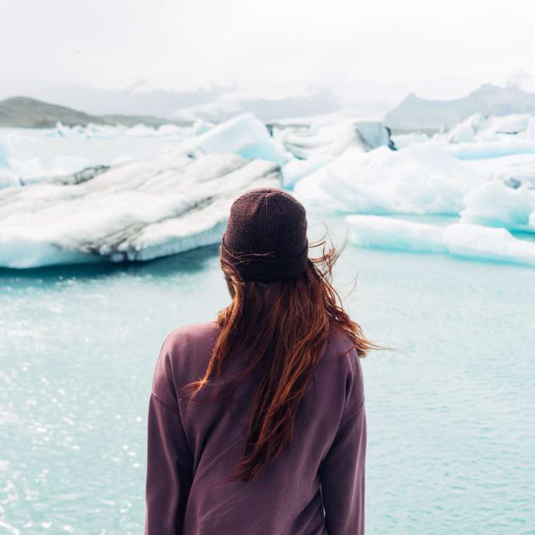 A woman in Iceland looking at glaciers
