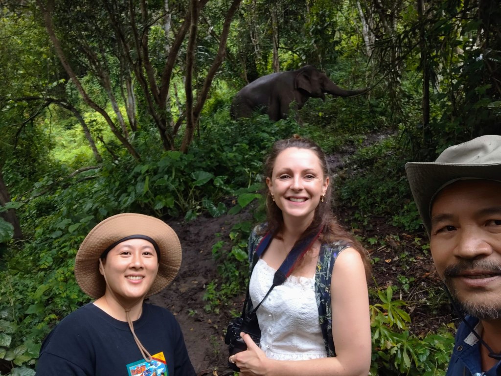 Charlie Darlington and guides in Thailand posing with Elephant