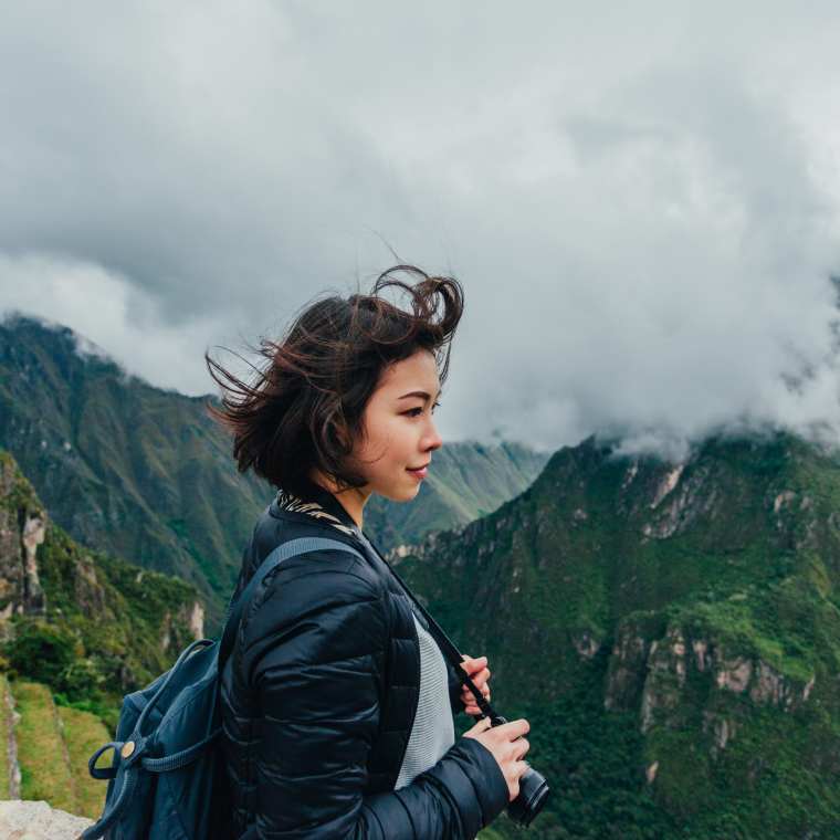 A woman hiking in Machu Picchu Peru