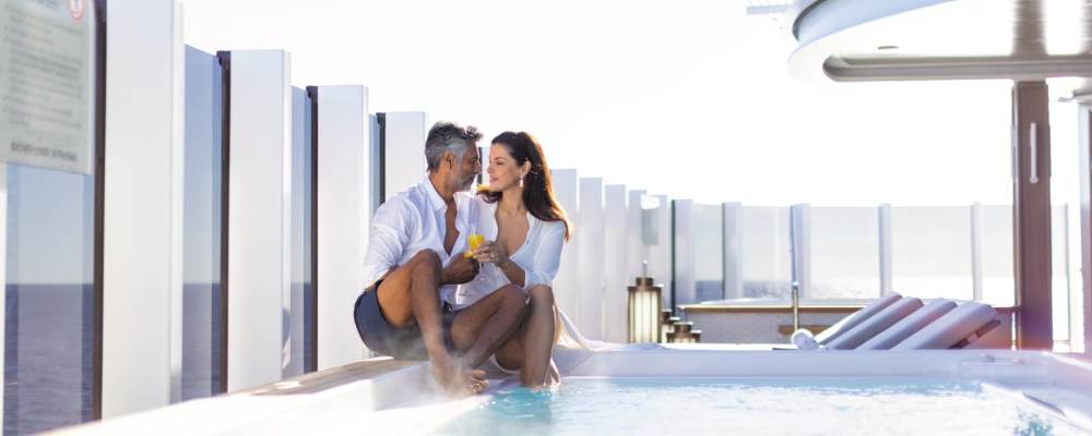 Couple at the pool on the Regent Seven Seas Grandeur