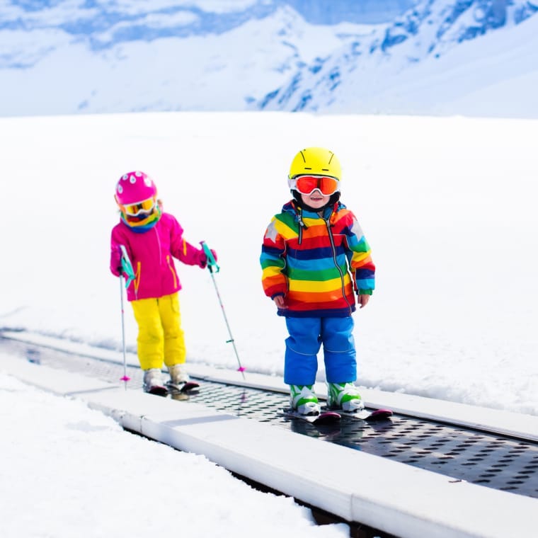 Two kids skiing